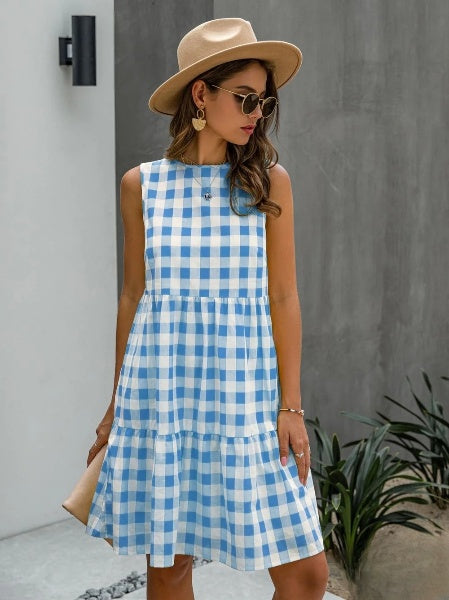 Modisches Damen-Kleid mit lockerem Rundhalsausschnitt und pastellfarbenem Karo-Rock