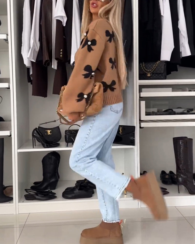 Heidi-Mode | Cardigan mit Schleifenbindung und Schleifenmotiv