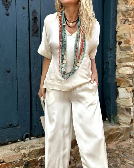 Heidi-Mode | Elegantes Weißes V-Ausschnitt Top & Weitbeinige Hose Set