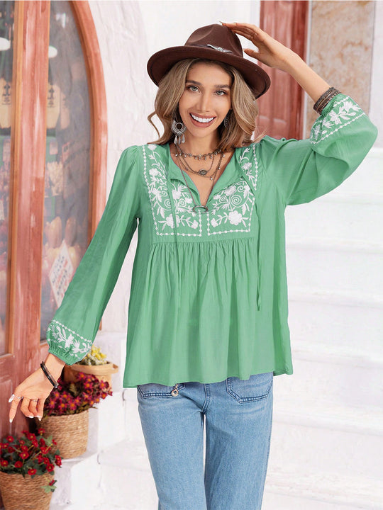 Heidi-Mode | Florale Bindekragen Bluse mit Ballonärmeln