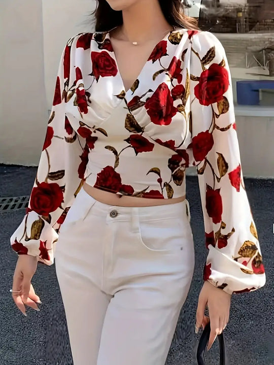 blouse met V-hals en strik op de rug met rozenprint