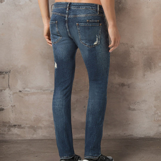 Stretch-Jeans mit gerissenen Kanten in schmaler Passform