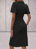 elegante wikkeljurk met korte mouwen