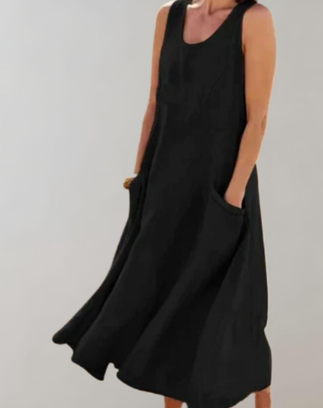 Comfortabele loose fit mouwloze katoenen jurk met een U-hals en zakken