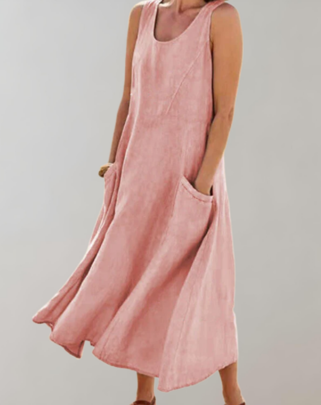 Comfortabele loose fit mouwloze katoenen jurk met een U-hals en zakken