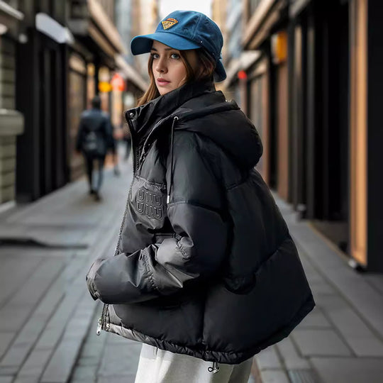 Damen gesteppte Winterjacke mit Kapuze und praktischen Taschen Heidi-Mode