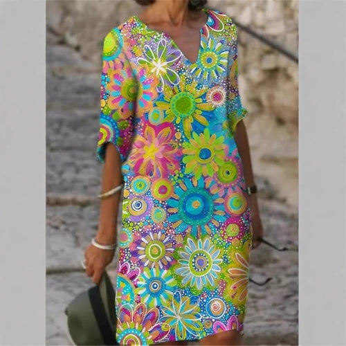 Damen Strandkleid im bunten Blumenmuster mit V-Ausschnitt und weitem Schnitt Heidi-Mode