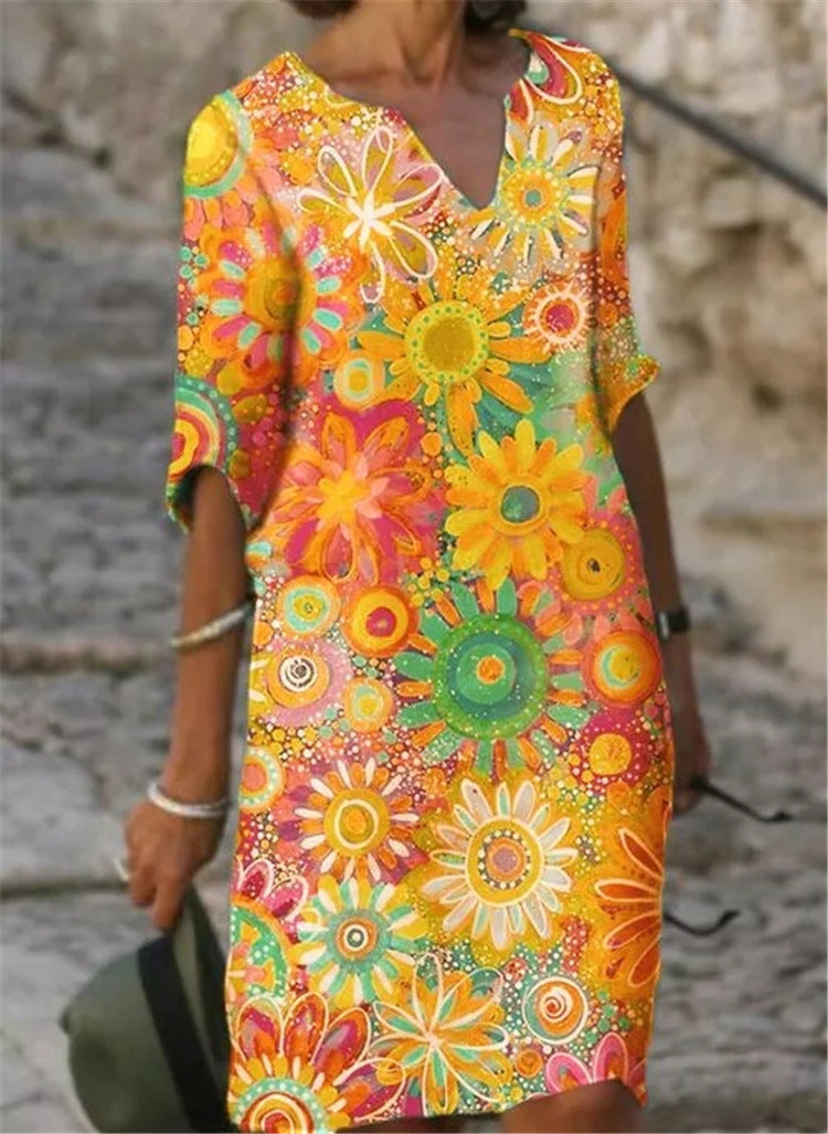 Damen Strandkleid im bunten Blumenmuster mit V-Ausschnitt und weitem Schnitt Heidi-Mode