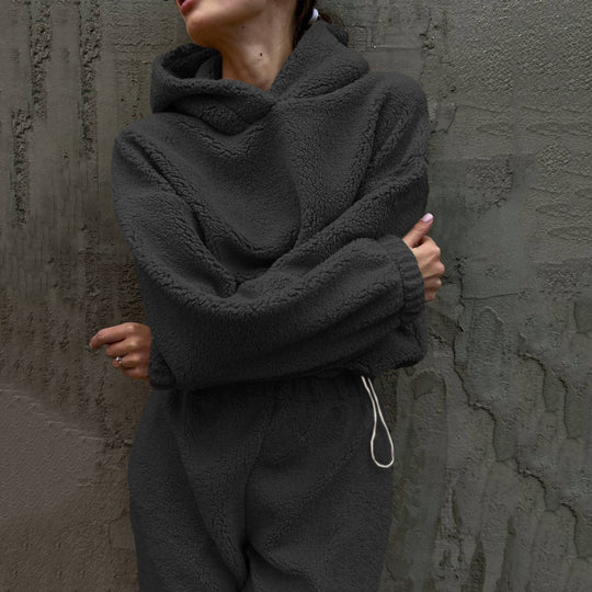 Damen gemütlicher Fleece-Jumpsuit mit elastischem Bund und Kapuze Heidi-Mode