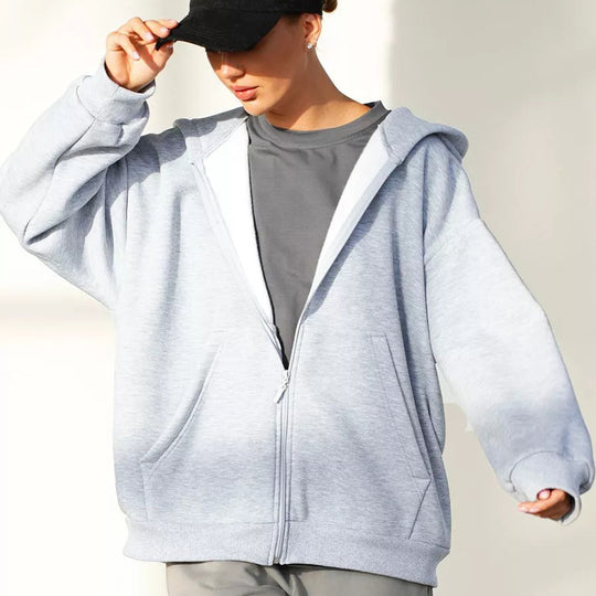 Damen oversized Kapuzenjacke mit durchgehendem Reißverschluss und großen Taschen Heidi-Mode
