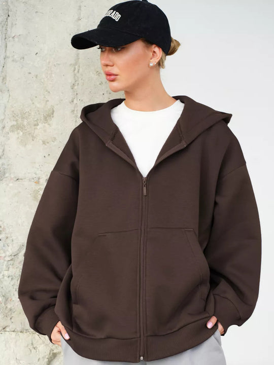 Damen oversized Kapuzenjacke mit durchgehendem Reißverschluss und großen Taschen Heidi-Mode