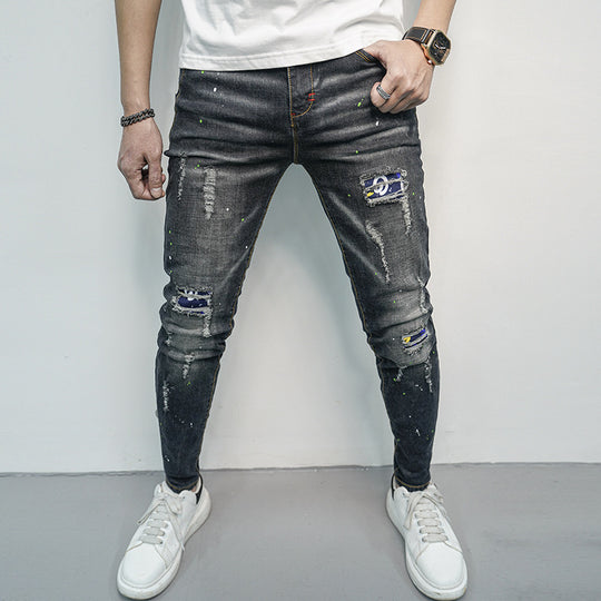 Herren Skinny Fit Jeans im kreativen Rissdesign und bunten Farbsklecks Heidi-Mode