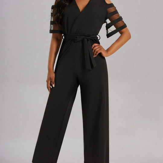 Damen Eleganter Jumpsuit mit transparenten Ärmel-Details und Taillengürtel Heidi-Mode