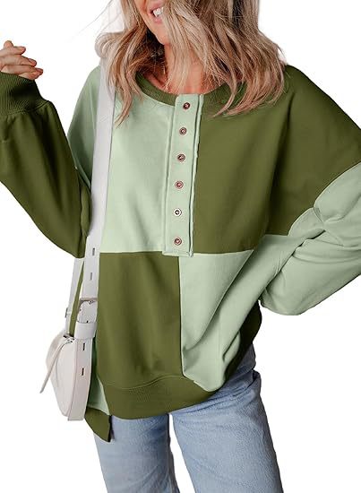 Damen lässiger Kapuzenpullover mit Knopfdetails und Farbblockdesign Heidi-Mode