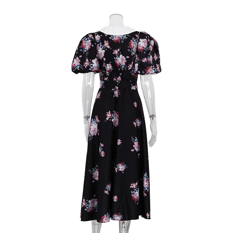 Midikleid mit Blumenakzenten und Puffärmeln