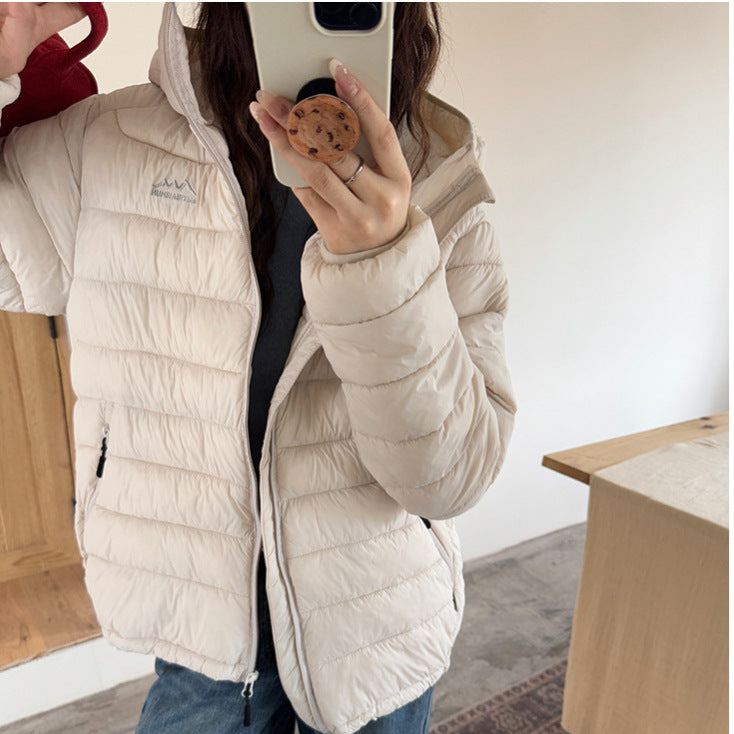 Damen ultraleichte Pufferjacke mit abnehmbarer Kapuze und elastischem Saum Heidi-Mode