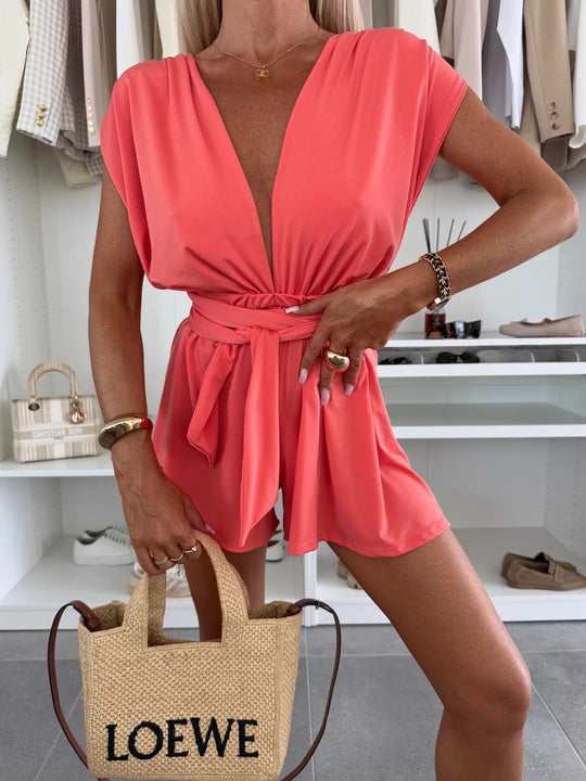 Damen Eleganter Jumpsuit mit tiefem V-Ausschnitt und Taillengürtel Heidi-Mode