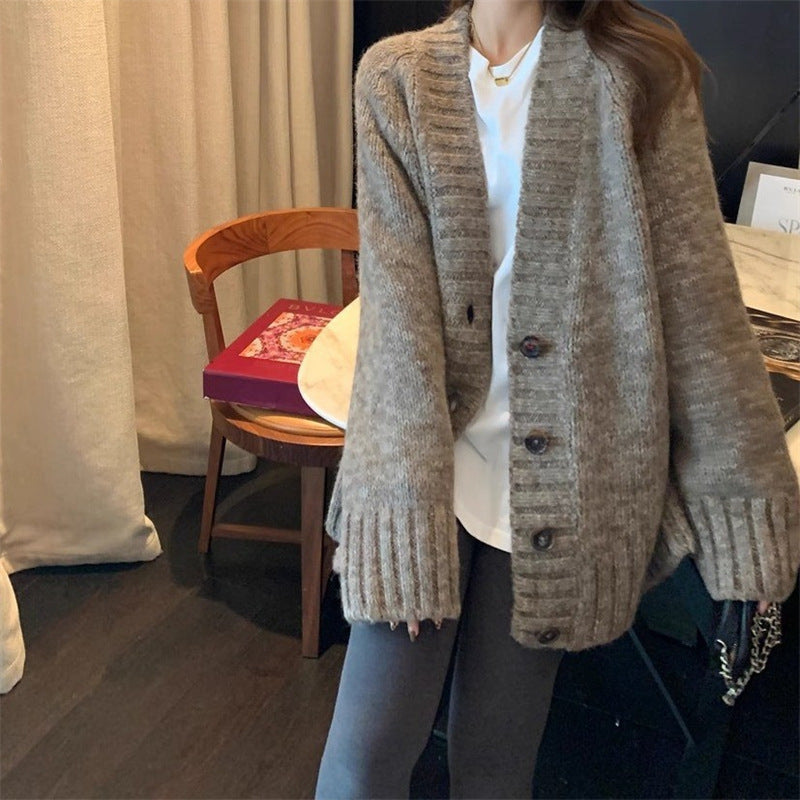 Damen Grobstrickjacke mit voluminösen Ärmeln und knöpfbarem Ausschnitt Heidi-Mode