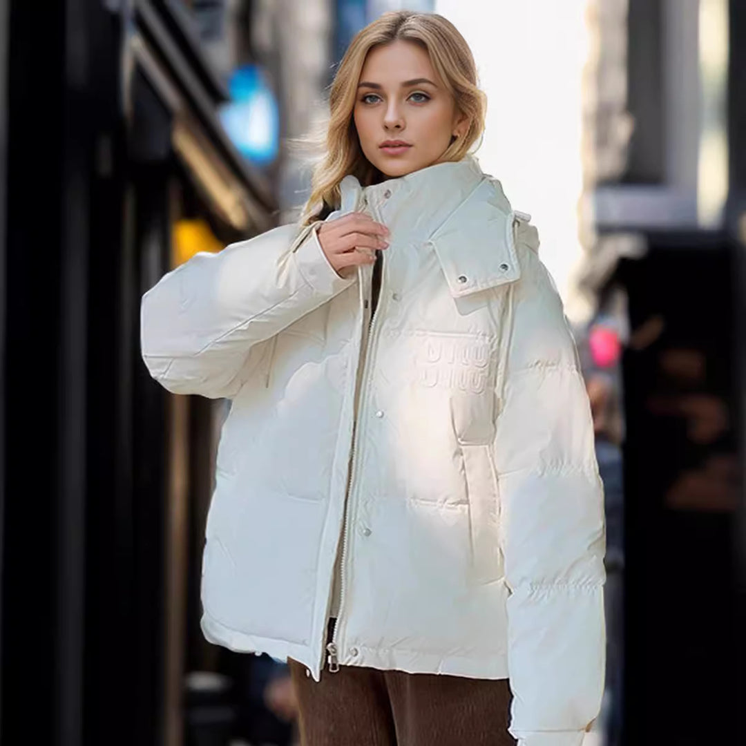 Damen gesteppte Winterjacke mit Kapuze und praktischen Taschen Heidi-Mode