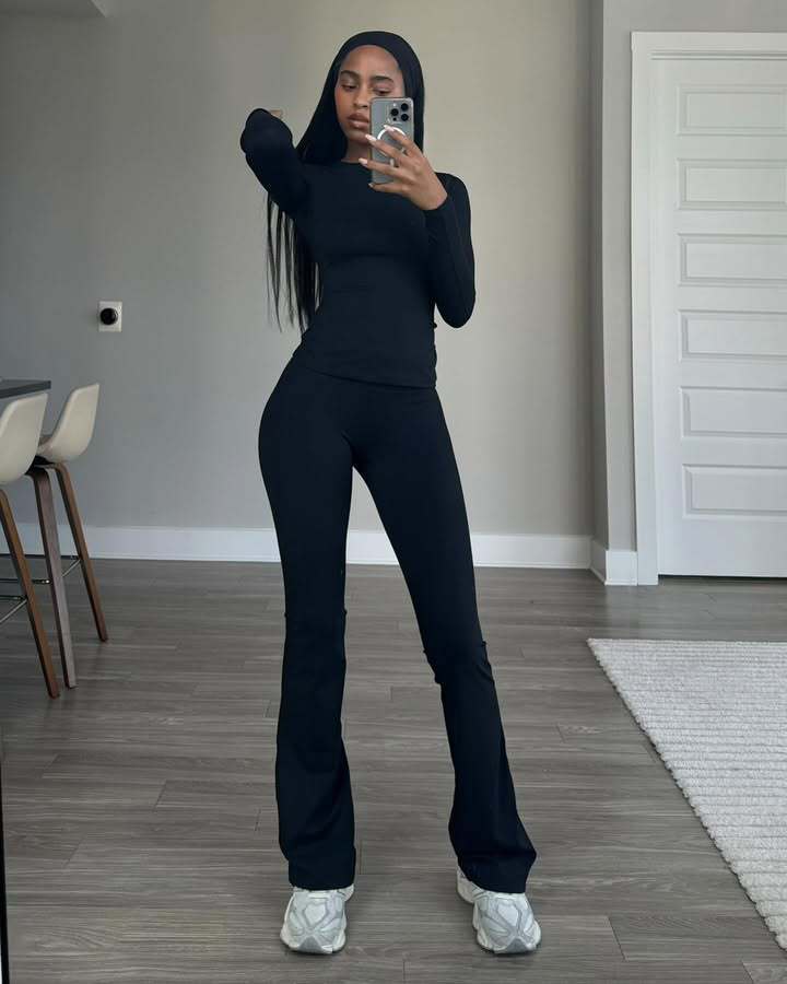 Damen Eleganter körperbetonter Jumpsuit mit langen Ärmeln und ausgestelltem Bein Heidi-Mode