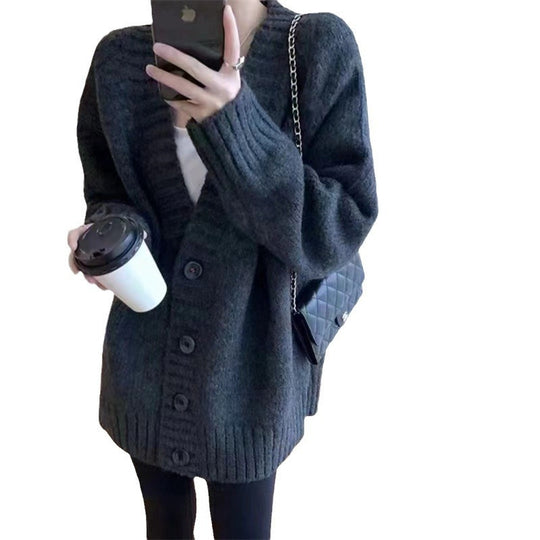 Damen Grobstrickjacke mit voluminösen Ärmeln und knöpfbarem Ausschnitt Heidi-Mode