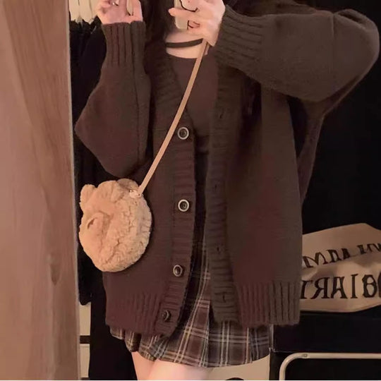 Damen Grobstrickjacke mit voluminösen Ärmeln und knöpfbarem Ausschnitt Heidi-Mode