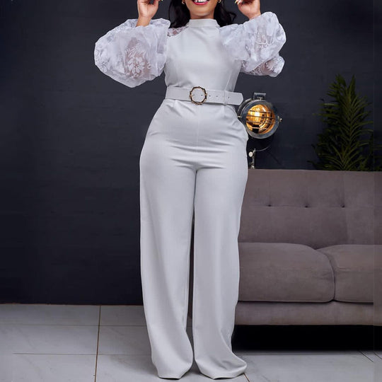 Damen Jumpsuit mit transparenten Puffärmeln und taillierbarem Gürtel Heidi-Mode