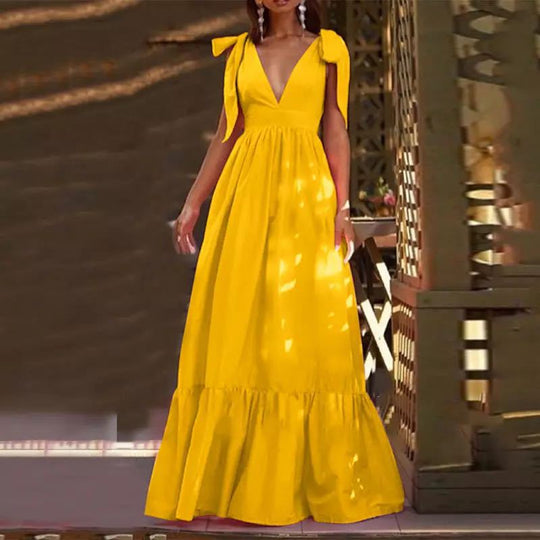 Damen Maxikleid mit tiefem V-Ausschnitt und verspielten Schleifen Heidi-Mode