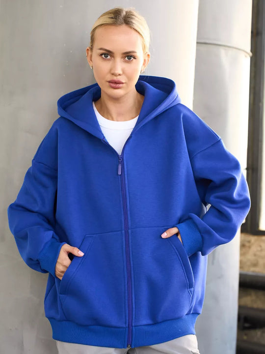 Damen oversized Kapuzenjacke mit durchgehendem Reißverschluss und großen Taschen Heidi-Mode