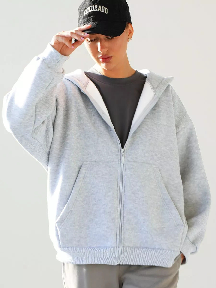 Damen oversized Kapuzenjacke mit durchgehendem Reißverschluss und großen Taschen Heidi-Mode