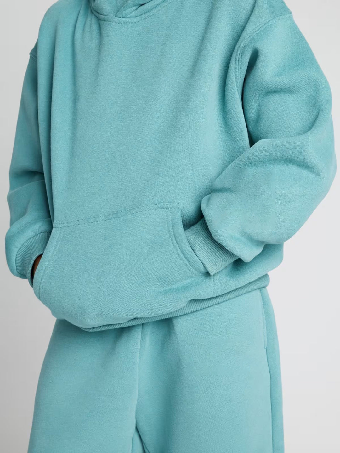 Damen lässiger Fleece-Jumpsuit mit geräumiger Kapuze und praktischen Taschen Heidi-Mode