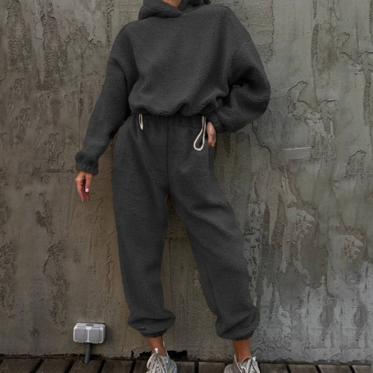 Damen gemütlicher Fleece-Jumpsuit mit elastischem Bund und Kapuze Heidi-Mode