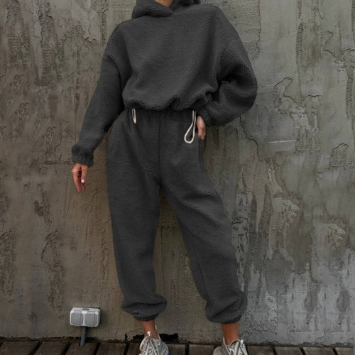 Damen gemütlicher Fleece-Jumpsuit mit elastischem Bund und Kapuze Heidi-Mode