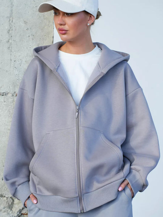 Damen oversized Kapuzenjacke mit durchgehendem Reißverschluss und großen Taschen Heidi-Mode