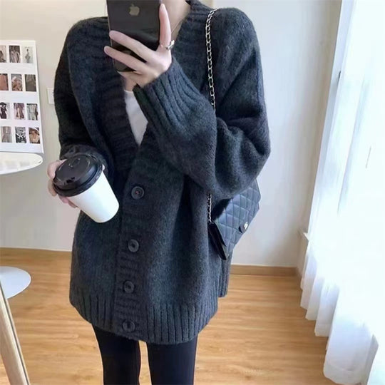 Damen Grobstrickjacke mit voluminösen Ärmeln und knöpfbarem Ausschnitt Heidi-Mode
