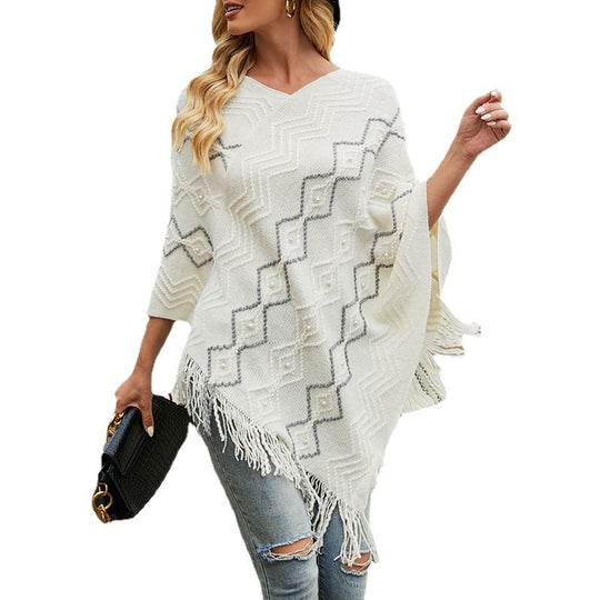 Damen eleganter Poncho mit auffälligem Strukturmuster und dekorativen Fransen Heidi-Mode