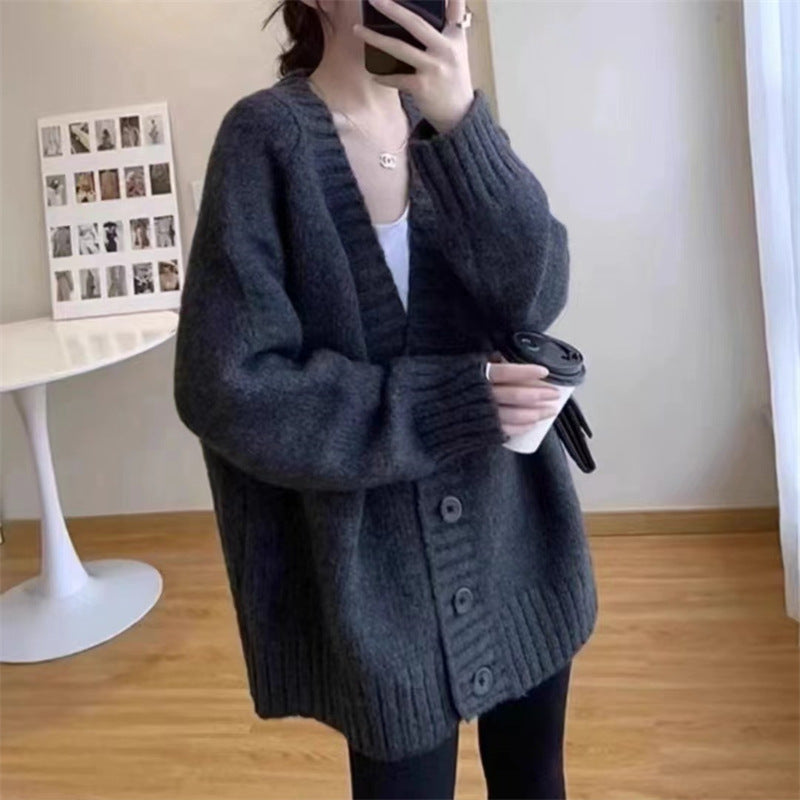 Damen Grobstrickjacke mit voluminösen Ärmeln und knöpfbarem Ausschnitt Heidi-Mode