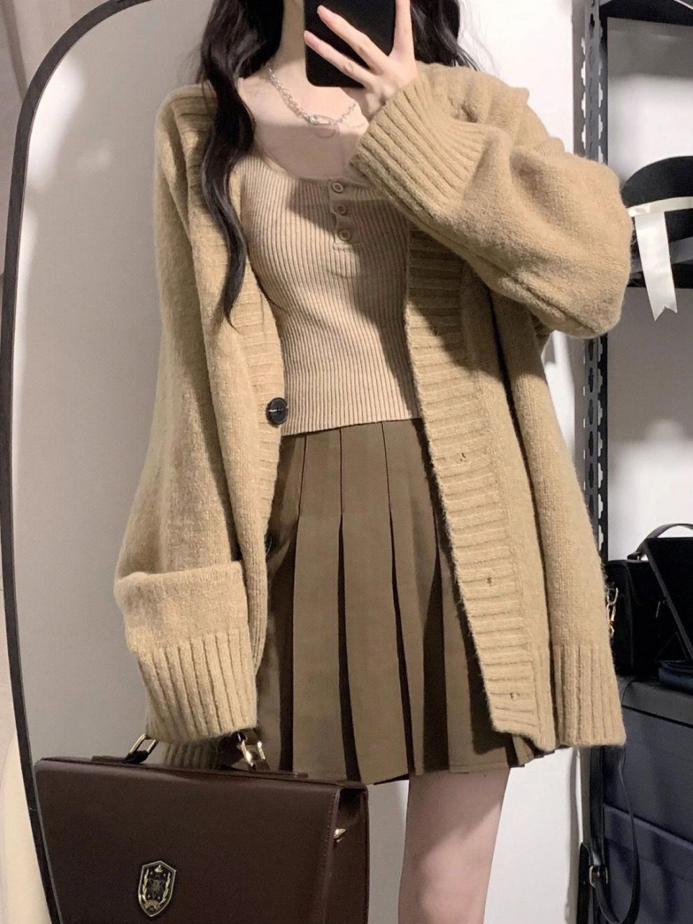 Damen Grobstrickjacke mit voluminösen Ärmeln und knöpfbarem Ausschnitt Heidi-Mode