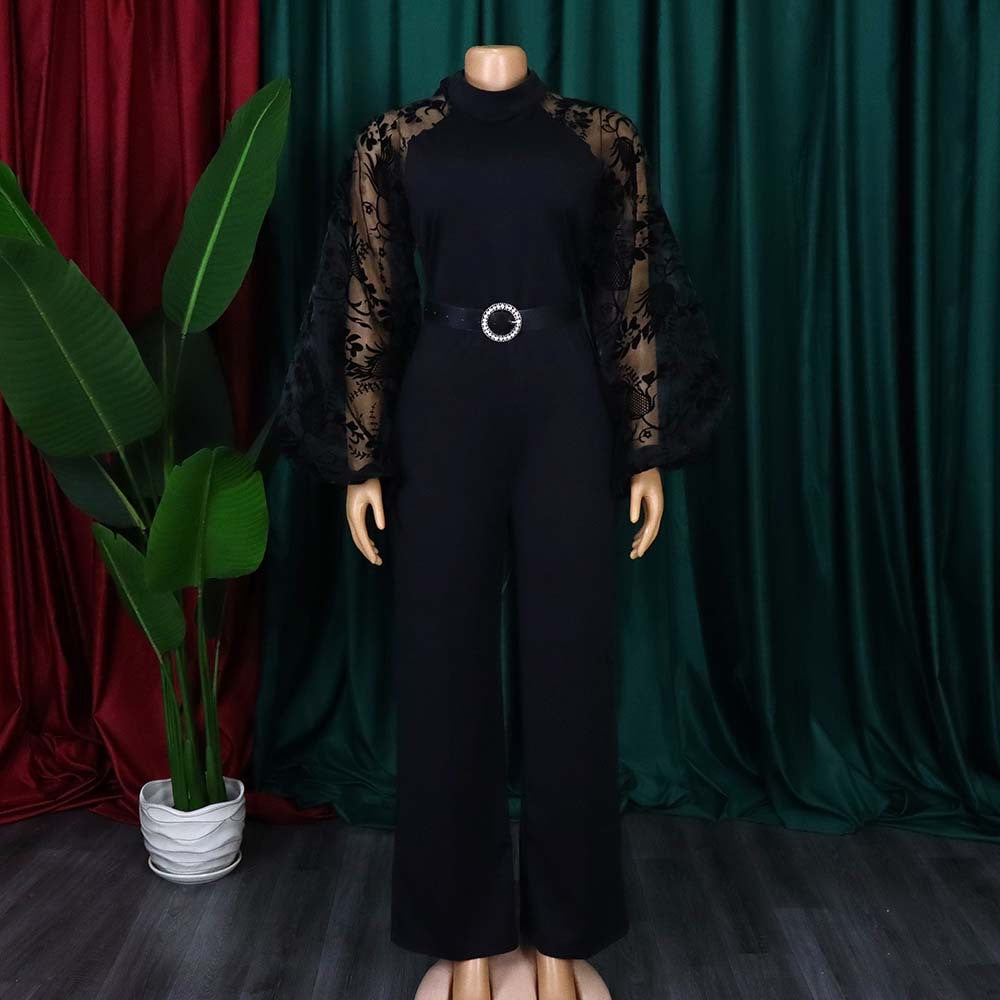 Damen Jumpsuit mit transparenten Puffärmeln und taillierbarem Gürtel Heidi-Mode
