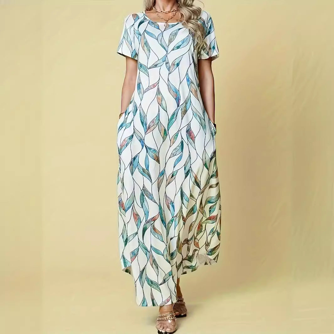 Damen Maxikleid mit elegantem Blattmuster und praktischen Taschen Heidi-Mode