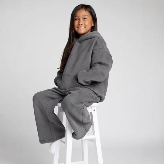 Damen lässiger Fleece-Jumpsuit mit geräumiger Kapuze und praktischen Taschen Heidi-Mode