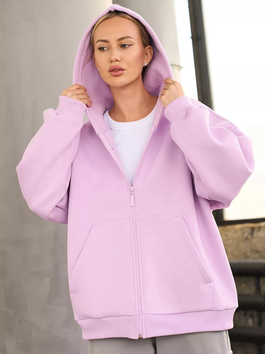 Damen oversized Kapuzenjacke mit durchgehendem Reißverschluss und großen Taschen Heidi-Mode
