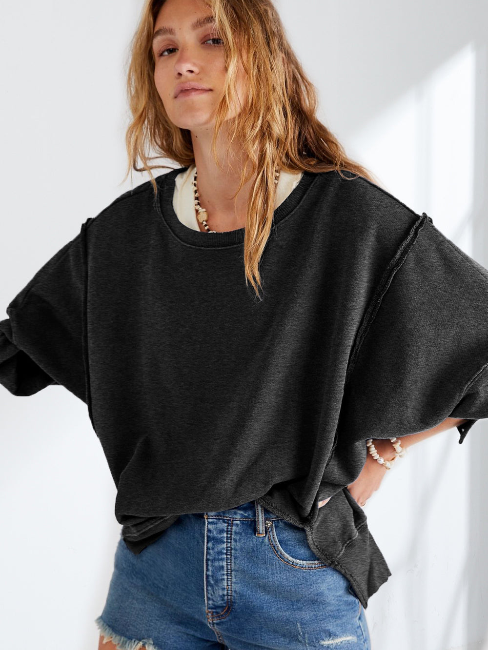 Damen Oversized Sweatshirt mit kreativem Saumdesign Heidi-Mode