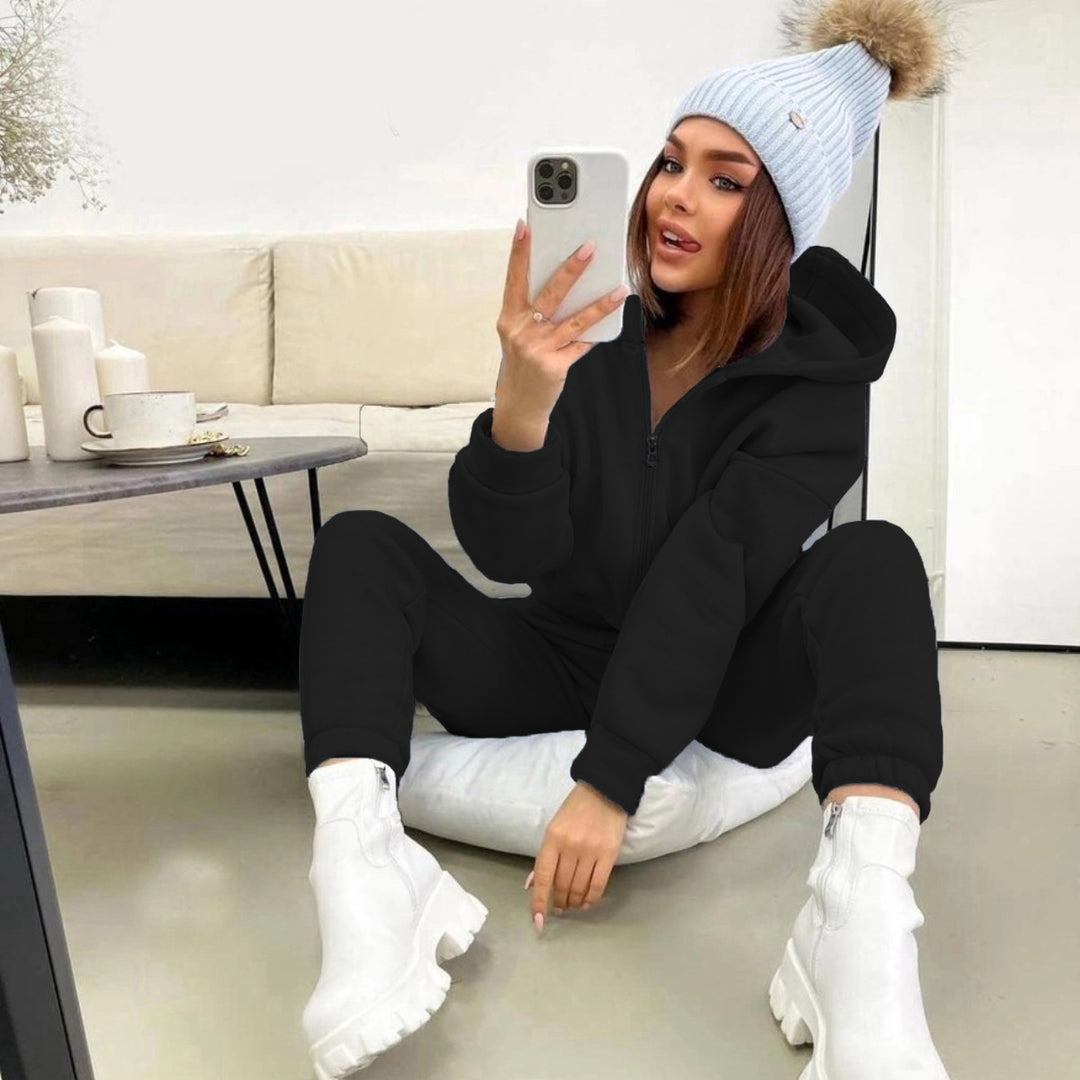 Damen Sportlicher Jumpsuit mit durchgehendem Reißverschluss und Kapuze Heidi-Mode