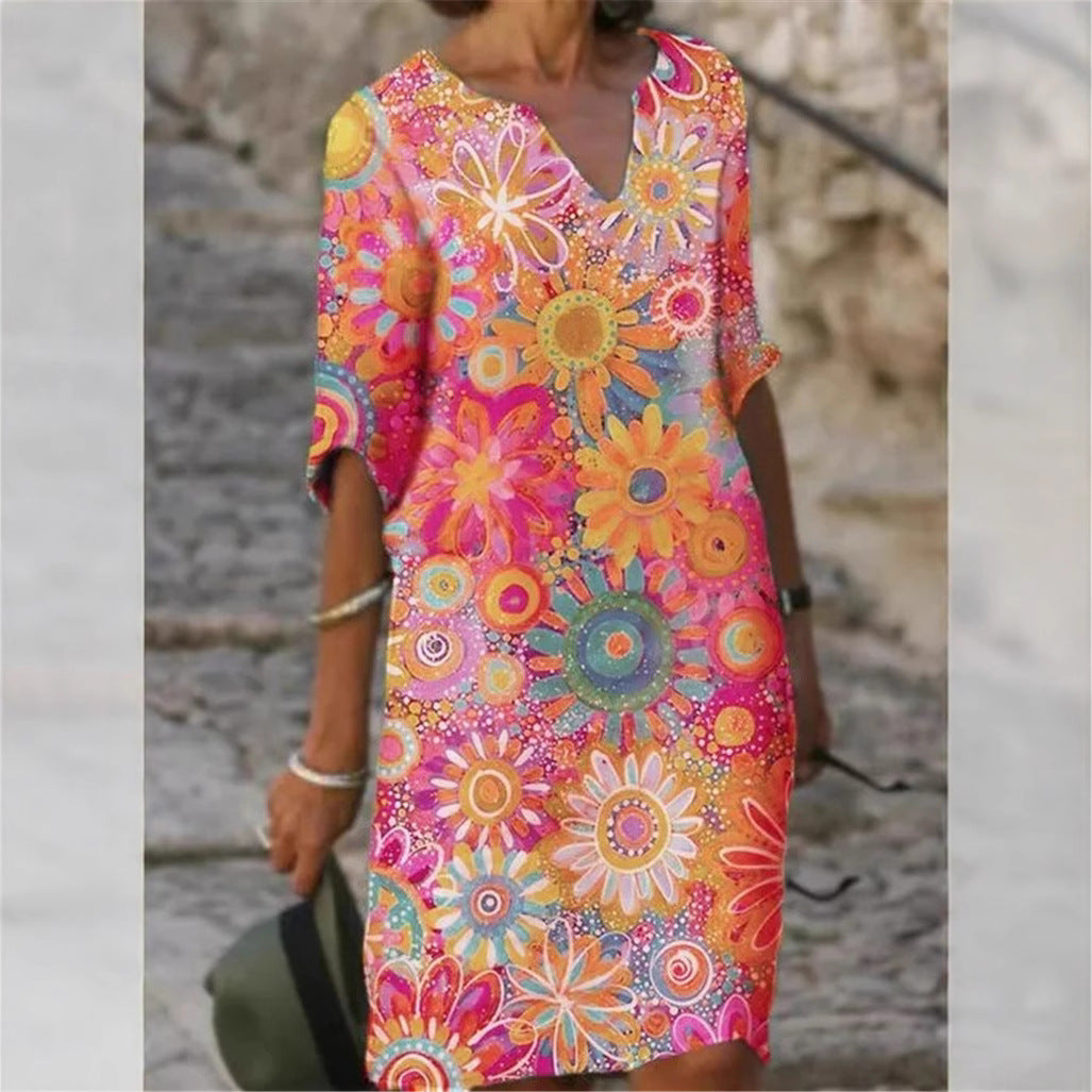 Damen Strandkleid im bunten Blumenmuster mit V-Ausschnitt und weitem Schnitt Heidi-Mode