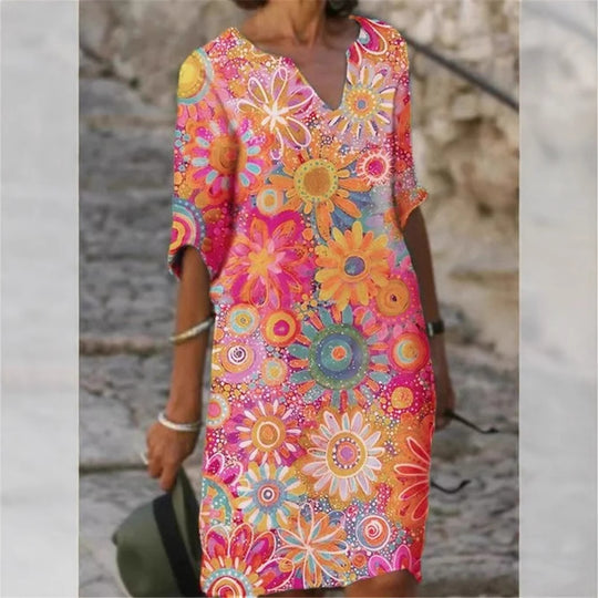 Damen Strandkleid im bunten Blumenmuster mit V-Ausschnitt und weitem Schnitt Heidi-Mode