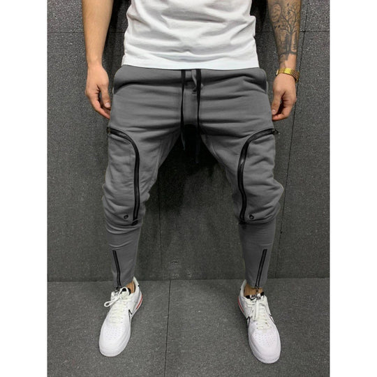 Herren Sportliche Jogginghose mit stylischen Reißverschlüssen und körpernahem Schnitt Heidi-Mode