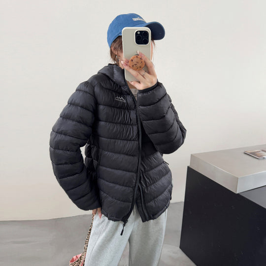 Damen ultraleichte Pufferjacke mit abnehmbarer Kapuze und elastischem Saum Heidi-Mode