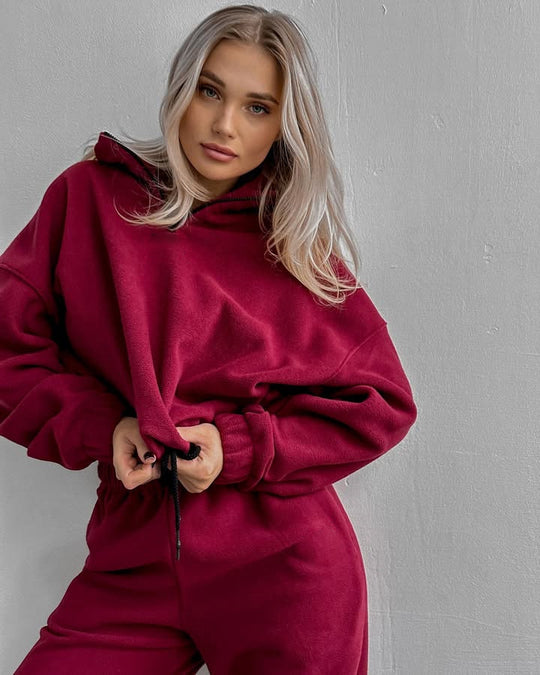 Damen gemütlicher Fleece-Jogginganzug mit hohem Kragen und Kängurutaschen Heidi-Mode