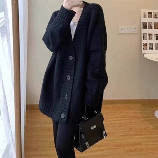 Damen Grobstrickjacke mit voluminösen Ärmeln und knöpfbarem Ausschnitt Heidi-Mode